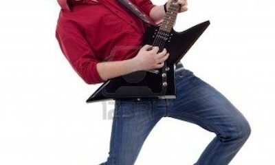 7059075-rock-star-with-a-guitar-isolated-over-white-background.jpg